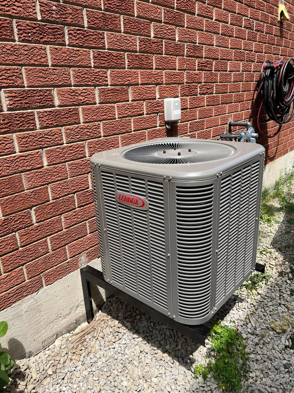 Lennox central air conditioner condenser installed by Delson Air beside a GTA home