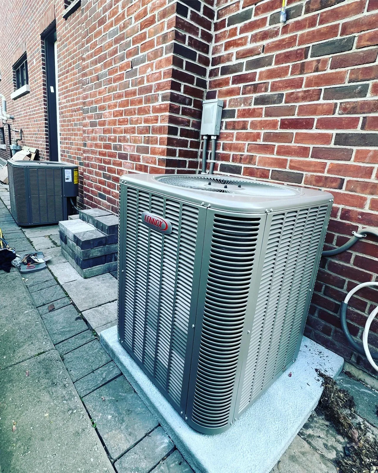 Outdoor AC condenser unit running during a GTA summer heat wave