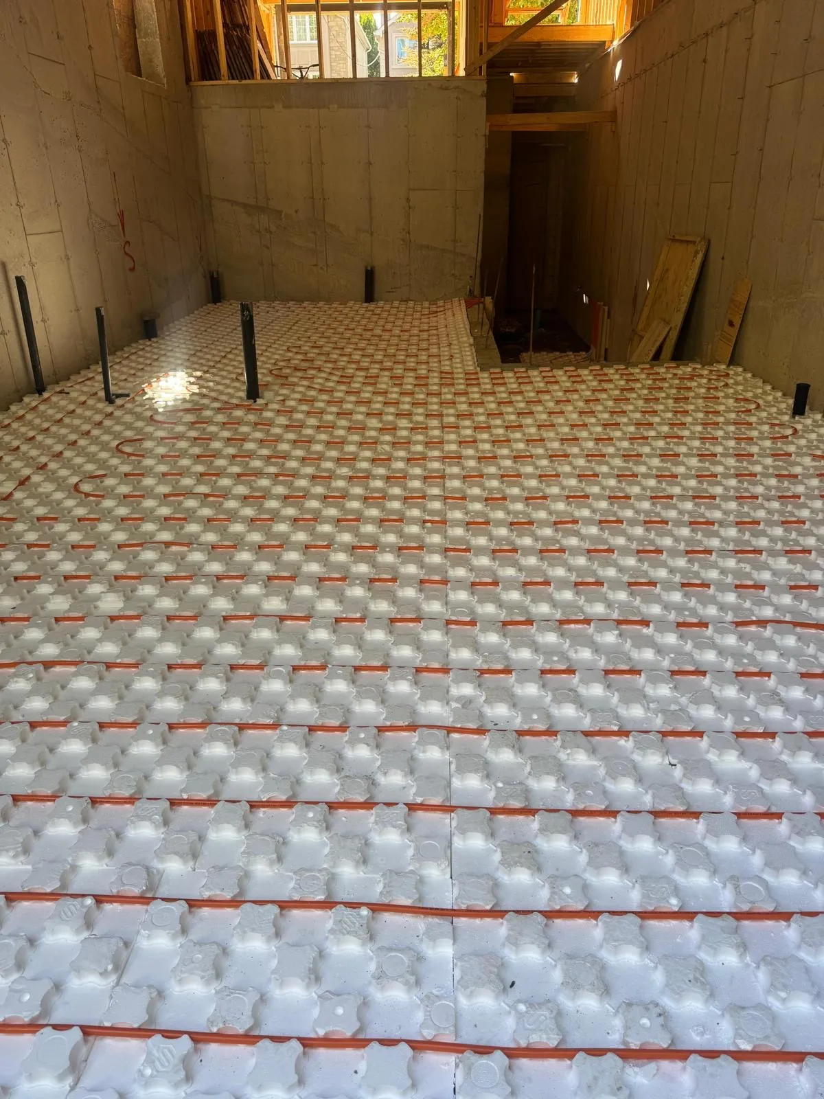 Real hydronic in-floor radiant heating tubing laid in a GTA home subfloor by Delson Air